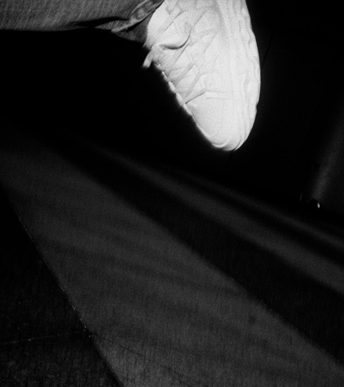 Shoe Radicle OG depicted only partly because worn by someone in movement