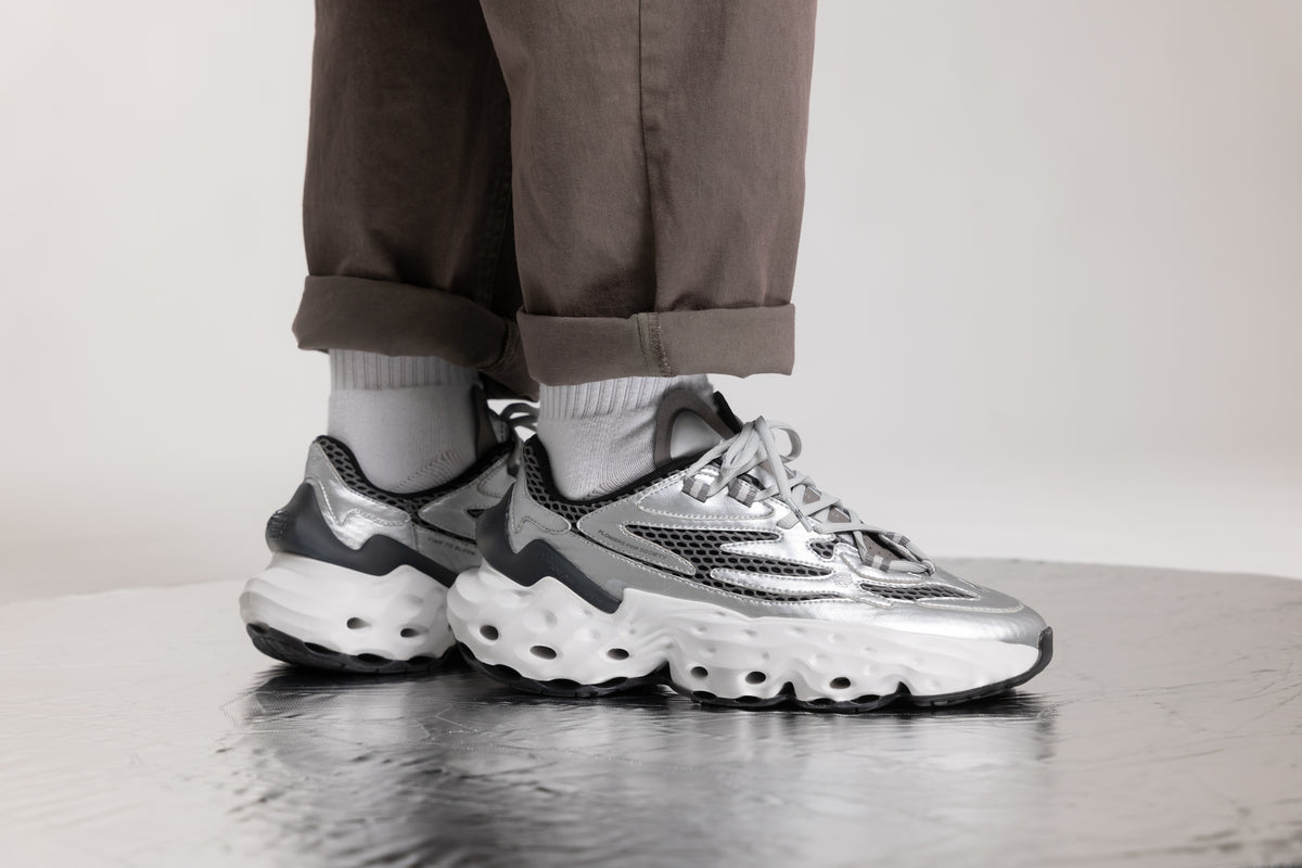 Flowers For Society Sneaker Seed.One Sterling silver lateral worn by model standing